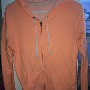 bright orange zip up